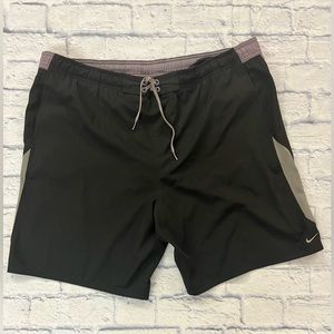 Nike mens’ swim trunks sz XXL black with pale lilac trim and swoosh. Tie waist